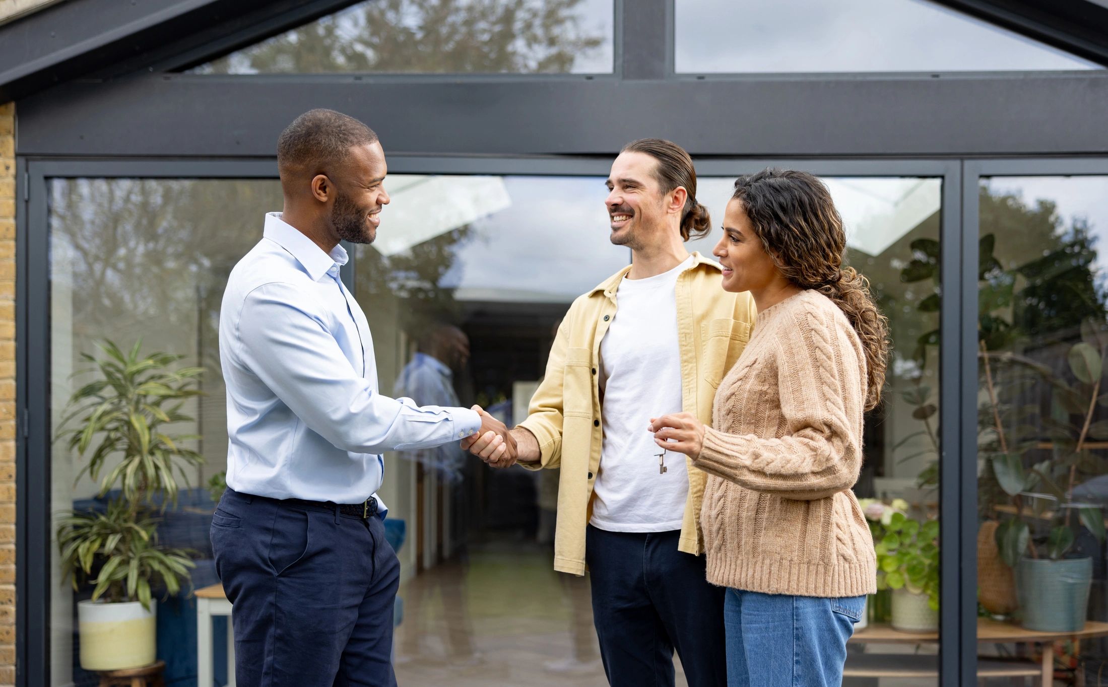 Professional handshake closing a real estate deal